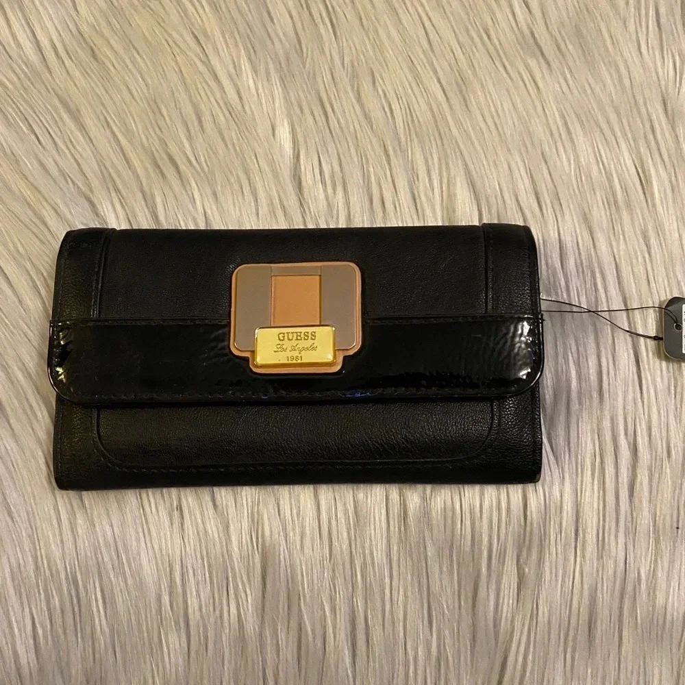 🆕 Guess Black with Tan Accent Buckle on Front Wallet